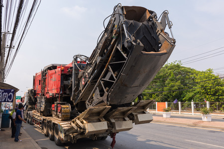 Ang Thong, Thailand - May 2, 2016 : Sugar cane harvesters on trailer truck for move to work.