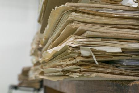 Files in old folder stacking up in a messy order.の写真素材