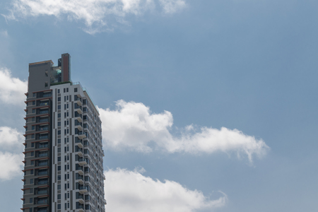Big office building and sky in a Bangkok cityの写真素材