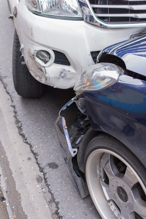 Bangkok, Thailand - June 17, 2016 : Car crash from car accident on the road in a city between saloon versus pickup wait insurance.のeditorial素材