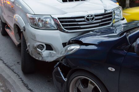 Bangkok, Thailand - June 17, 2016 : Car crash from car accident on the road in a city between saloon versus pickup wait insurance.のeditorial素材