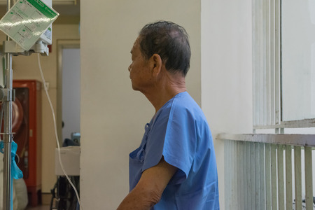 Bangkok, Thailand - July 19, 2015 : Unidentified patient elderly waiting a doctor and nurse in hospitalのeditorial素材
