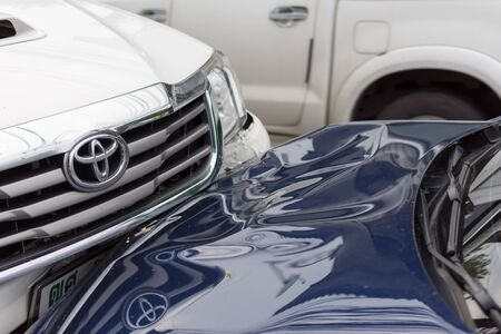 Bangkok, Thailand - June 17, 2016 : Car crash from car accident on the road in a city between saloon versus pickup wait insurance.のeditorial素材