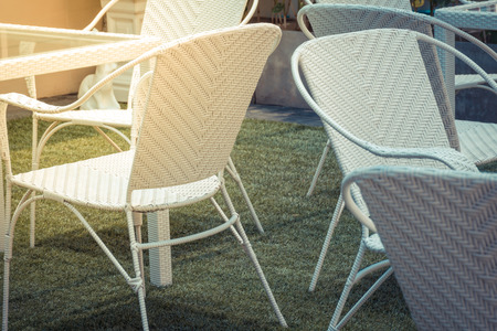 Furniture white chair and glass table decoration for outdoor garden , process in vintage styleの写真素材