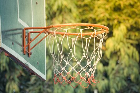 Basketball hoop make by wooden and ball in park , process in vintage style