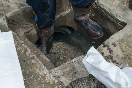 Working for drain cleaning. Problem with the drainage system.の写真素材