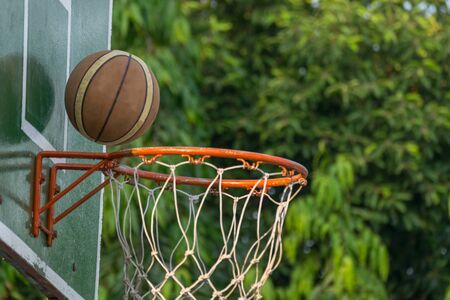 Basketball hoop make by wooden and ball in park