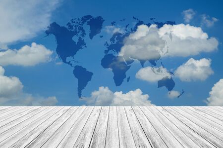 Wood terrace and Blue sky and white cloud with world mapの写真素材