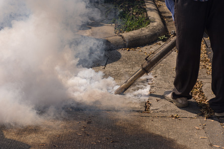 People fogging DDT spray kill mosquito for control Malaria, Encephalitis, Dengue and Zika in village at Bangkok Thailand.の写真素材