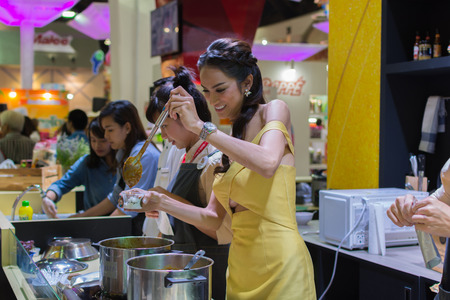 Bangkok, Thailand - May 28, 2016 : Unidentified asia women serving hot curry for tasting in food festival.のeditorial素材