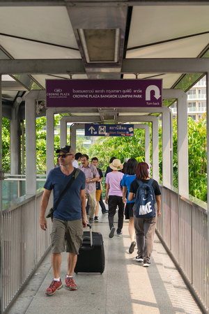 Bangkok, Thailand - March 31, 2016 : Skywalk at BTS skytrain train in Bangkok. Many people in Bangkok used skytrain to save time.のeditorial素材