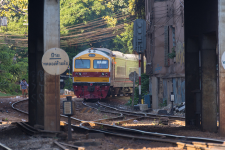 Bangkok, Thailand - November 14, 2016 : Unidentified railway train on the railroad tracks in Bangkok station. Many people in Thailand popular travel by train because it is cheaper.のeditorial素材