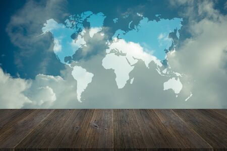 Nature cloudscape with blue sky and white cloud with Wood terrace and world map , process in vintage styleの写真素材