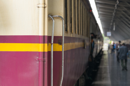 Railway train on the railroad tracks in Bangkok station. Many people in Thailand popular travel by...