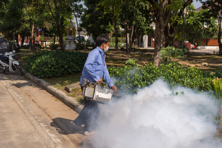 People fogging DDT spray kill mosquito for control Malaria, Encephalitis, Dengue and Zika in village at Bangkok Thailand.の写真素材