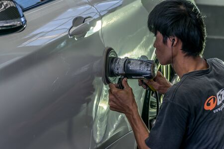 Bangkok, Thailand - December 12, 2015 : Unidentified car care staff cleaning the car (Car detailing).のeditorial素材