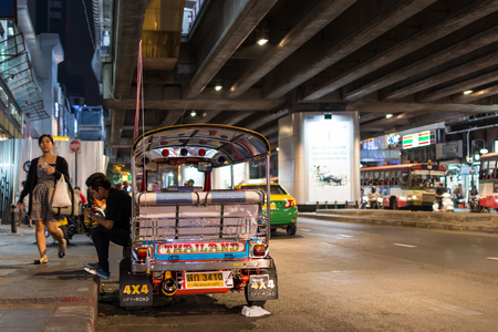 Bangkok, Thailand -March 2, 2017 : Unidentified Thai TukTuk taxi wait for a tourist on footpath at Patpong night market on silom road internationally tourist popular visited to Patpong.のeditorial素材