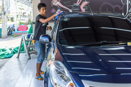 Bangkok, Thailand - March 11, 2017 : Unidentified car care staff cleaning the car (Car detailing).のeditorial素材
