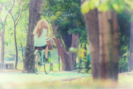 Blurred of People riding a bicycle by cycling on a bicycle lane in a outdoor park for exercise healthyの写真素材