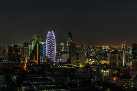 Bangkok, Thailand - April 11, 2017 : Cityscape and light of city with light show from building in night time from skyscraper of Bangkok. Bangkok is the capital and the most populous city of Thailand.のeditorial素材