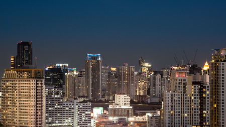 Bangkok, Thailand - April 12, 2017 : Cityscape and light of city with light show from building in night time from skyscraper of Bangkok. Bangkok is the capital and the most populous city of Thailand.のeditorial素材