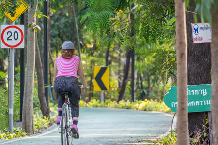 Bangkok, Thailand - March 15, 2017 : Unidentified people riding a bicycle by cycling on a bicycle lane in a outdoor park for exercise healthyのeditorial素材
