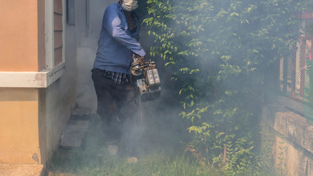 People fogging DDT spray kill mosquito for control Malaria, Encephalitis, Dengue and Zika in village at Bangkok Thailand.の写真素材