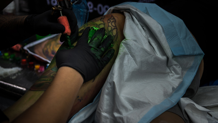 PathumThani, Thailand - May 6, 2017 : Unidentified professional tattoo artist drawing art on body at Body Art Tattoo Challenge 2017 Zeer Rangsit. This a open event no need press credentials required.のeditorial素材