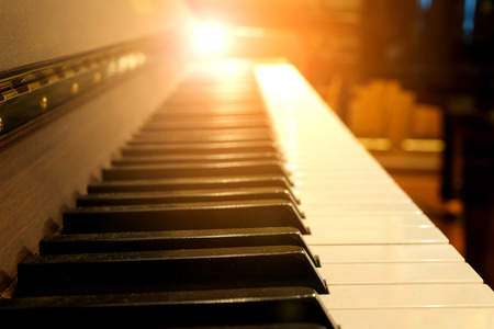 Piano keys on wooden musical instrumentの写真素材