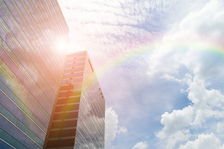 Glass building and blue sky with rainbowの写真素材