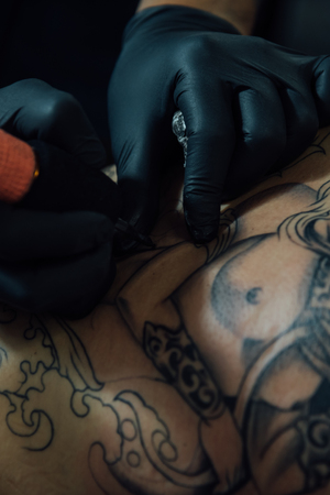 PathumThani, Thailand - May 6, 2017 : Unidentified professional tattoo artist drawing art on body at Body Art Tattoo Challenge 2017 Zeer Rangsit. This a open event no need press credentials required.のeditorial素材