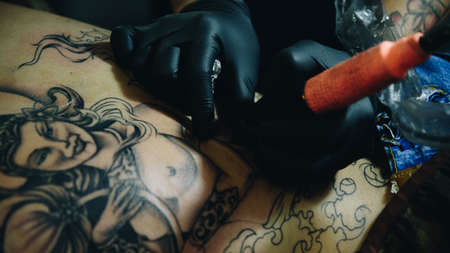 PathumThani, Thailand - May 6, 2017 : Unidentified professional tattoo artist drawing art on body at Body Art Tattoo Challenge 2017 Zeer Rangsit. This a open event no need press credentials required.のeditorial素材