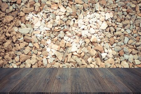 Stone wall texture background surface natural color , process in vintage style with wood terrace with world mapの写真素材