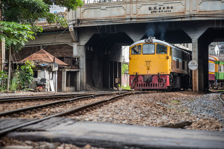 Bangkok, Thailand - July 12, 2017 : Unidentified railway train on the railroad tracks in Bangkok station. Many people in Thailand popular travel by train because it is cheaper.のeditorial素材