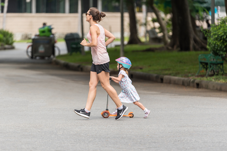 Bangkok, Thailand - July 29, 2017 : Unidentified woman jogger her jogging run on road runner in a outdoor park for exercise healthyのeditorial素材