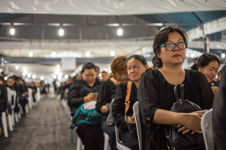 Bangkok, Thailand - March 11, 2017 : Unidentified Thai mourners wearing black color waiting in The Grand Palace to pay tribute and respect to their beloved Rama 9 Thai King Bhumibol Adulyadejのeditorial素材