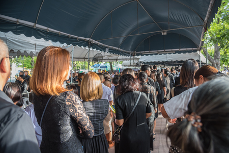 Bangkok, Thailand - August 25, 2017 : Unidentified Thai mourners wearing black color waiting in The Grand Palace to pay tribute and respect to their beloved Rama 9 Thai King Bhumibol Adulyadejのeditorial素材