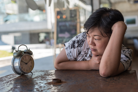 Asian women 40s white skin in black and white shirt sleep for relax or tired between waiting...