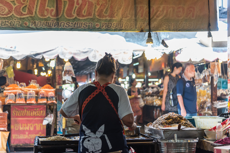 Chachoengsao, Thailand - October 15, 2017 : Unidentified chef cooking a Fried mussel pancakes or Mussel fried in egg batter (Hoi Tod) for sale at Thai street food marketのeditorial素材