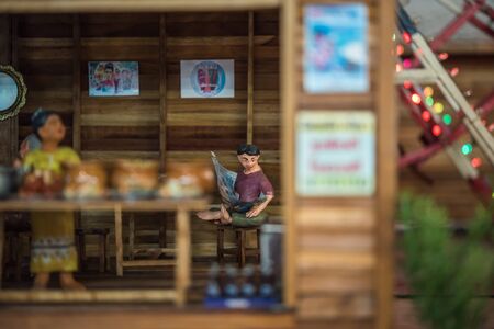PathumThani, Thailand - August 5, 2017 : Asian clay doll and wooden market store model with ancient lifestyle model at Zeer Rangsit. This a open event no need press credentials required.のeditorial素材