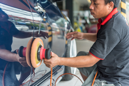 Bangkok, Thailand - November 11, 2017 : Unidentified car care staff cleaning the car (Car detailing).のeditorial素材
