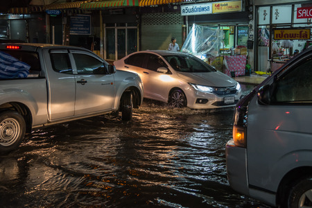 Bangkok, Thailand - June 7, 2017 : Water flood in Bangkok city problem with the manhole overflow in drainage system it full from garbage when rain storm.のeditorial素材