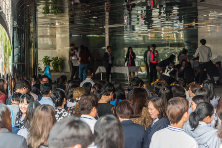 Bangkok, Thailand - November 30, 2017 : Many working people preparedness for fire drill or other disaster at office in Bangkok Thailandのeditorial素材