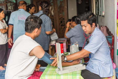 Bangkok, Thailand - December 3, 2017 : Unidentified Thai man health check by pressure gauge every year by the Ministry of Health.のeditorial素材