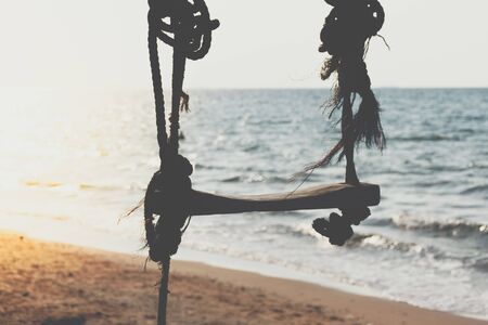 Landscape of travel place with nature at a beach and tropical sea with blue sky and have a outdoor swing use for relax in happy vacationの写真素材