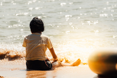 Asian girl travel and playing with fun and happy at sea LaemMaePhim beach. This white sandy cape can be easily reached from city.の写真素材