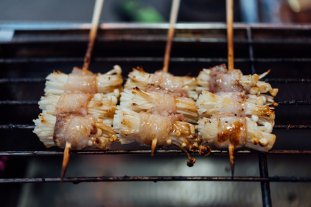 Mala is Grilled meat (Beef, Pork, Chickens or Mushroom) with chilli sauce and chinese hot spicy herb (Sichuan Pepper) for sale at Thai street food market or restaurant in Bangkok Thailandの写真素材