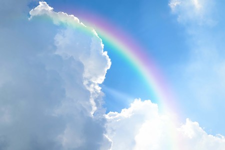 Cloudscape rainbow of natural sky with blue sky and white clouds and colorful rainbow in the sky use for wallpaper backgroundの写真素材