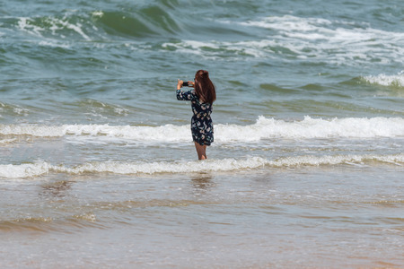 Chanthaburi, Thailand - July 9, 2017 : Unidentified asian people travel and playing with fun and happy at sea Kung Wiman Beach. Scenic beach featuring a small stretch of golden sand.のeditorial素材