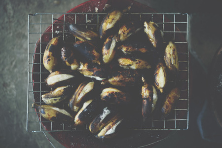 Roasted or Grilled Banana for sale at Thai street food market or restaurant in Thailandの写真素材